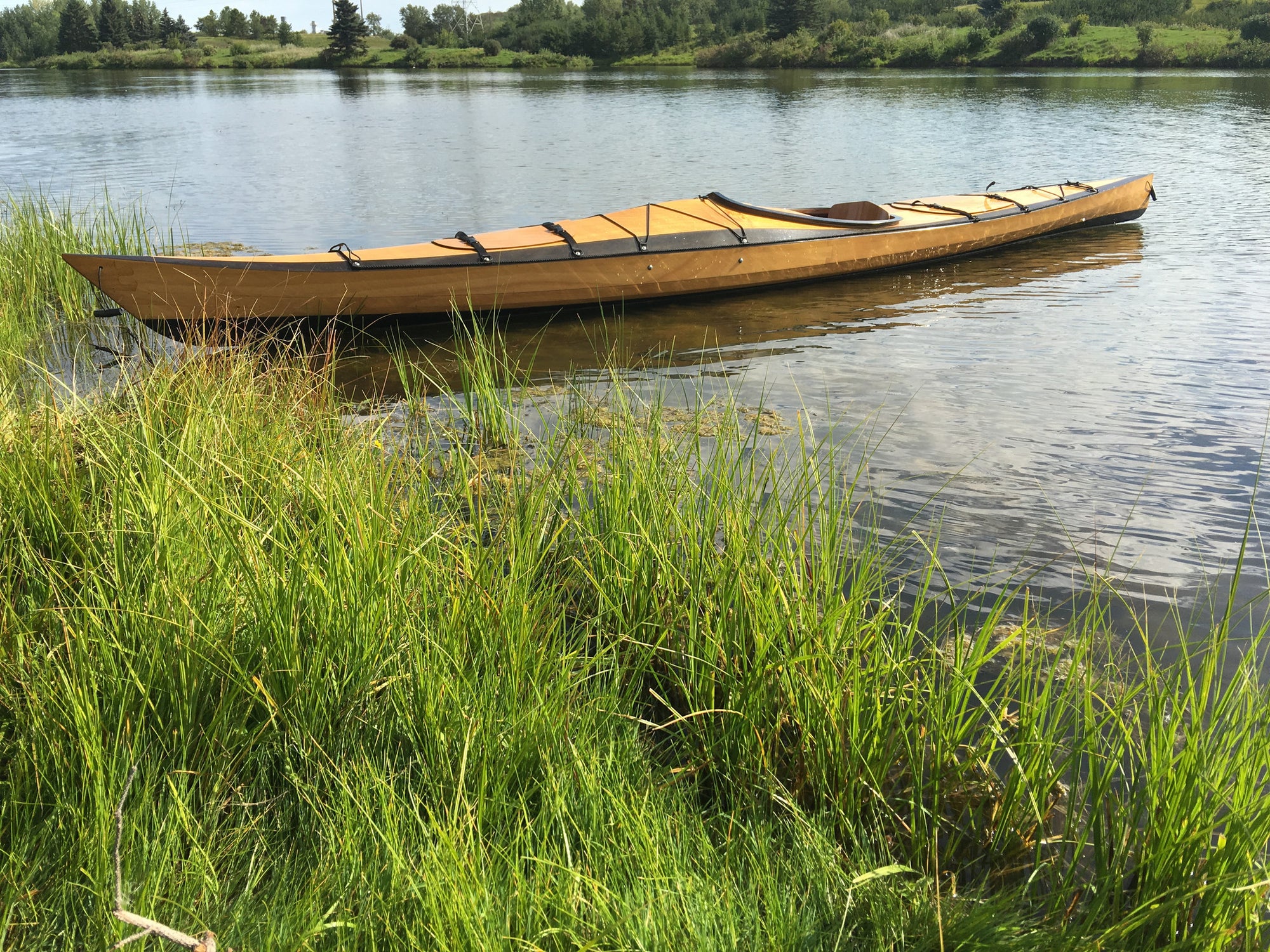 Solace 16EX side view in a lake